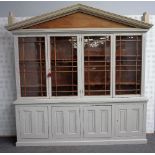 A grey painted bookcase cabinet,