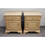A pair of grey/green painted bedside tables with single drawer over cupboard on ogee bracket feet,