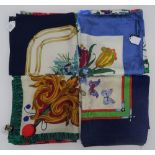A collection of four Italian printed silk scarves,