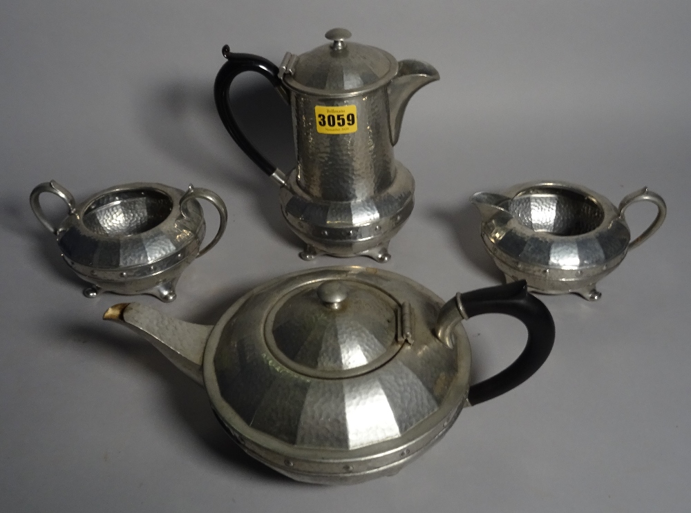 'Kendal & Dent'; an early 20th century pewter four piece tea set.