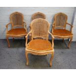 A set of four Louis XV style carved beech open armchairs with serpentine seats on cabriole supports,