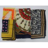 A collection of four designer silk scarves,