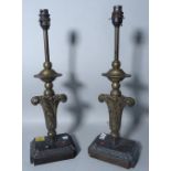 A pair of 19th century table lamps, each as an upright foliate finial, 47cm high,