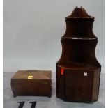 A Regency mahogany sarcophagus shaped tea caddy, 31cm wide x 20cm high,