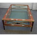 A large lacquered brass, glass and polychrome painted rectangular two tier coffee table,