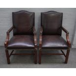 A pair of George III style mahogany framed hump back open armchairs on square supports,