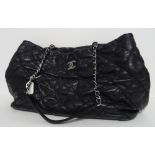 A Chanel black quilted leather tote bag, circa 2012-2013, with silver-tone hardware,