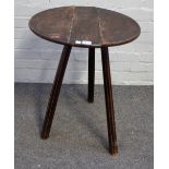 A 19th century cricket table, the circular top on three ash supports, 50cm diameter x 65cm high.