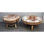 An African circular kettle drum table on three block supports, 95cm diameter x 47cm high,