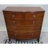 A late George III mahogany bowfront chest of two short and three long drawers,