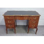 A Louis XV style gilt metal mounted rosewood and mahogany writing desk, of serpentine outline,
