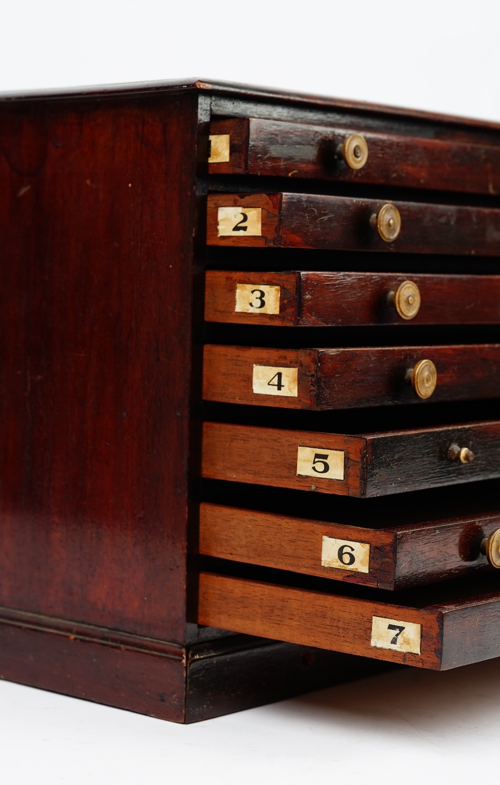 A 19th century mahogany table top collector's chest of seven long graduated drawers on a plinth - Image 2 of 4