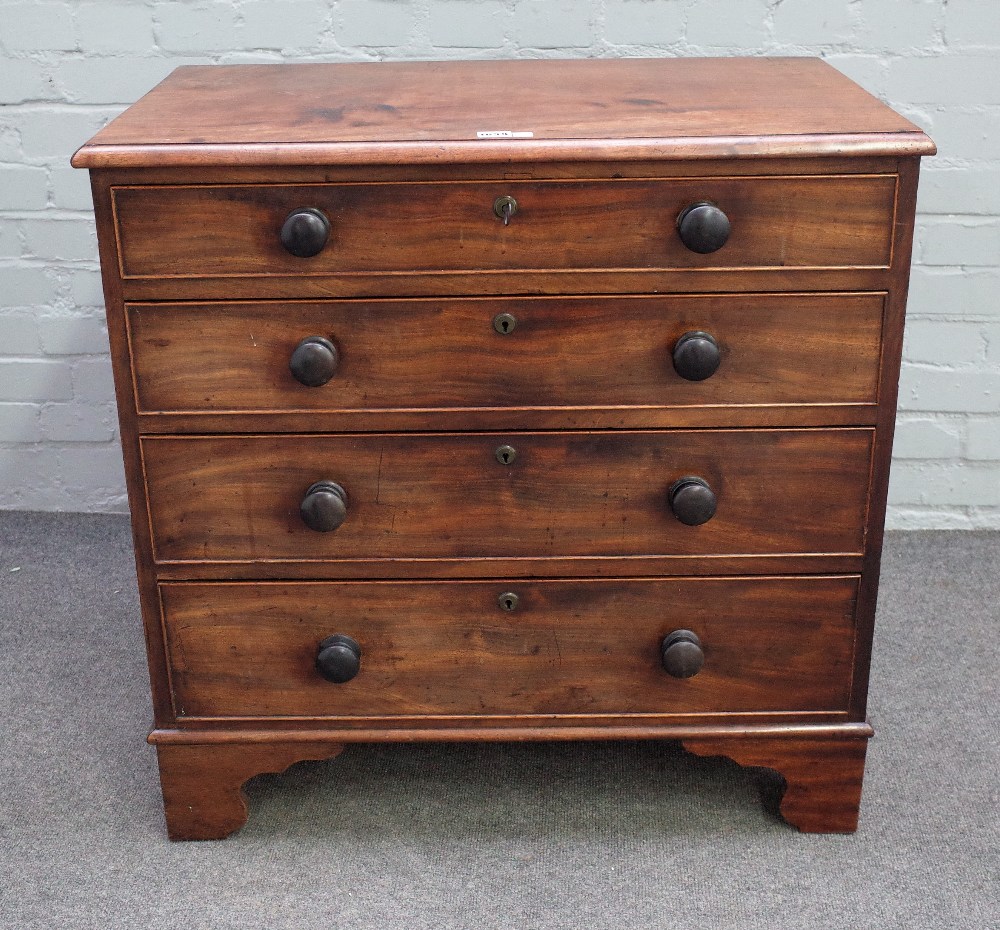 A George III small mahogany chest with four long graduated drawers on bracket feet,