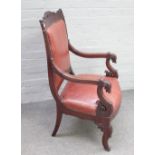 A Louis Philippe mahogany framed open armchair on capped sabre supports, 60cm wide x 102cm high.