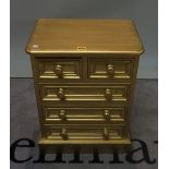 A modern gold painted chest of two short and three long drawers, 46cm wide x 56cm high.