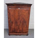 An early 18th century inlaid oak hanging corner cupboard with shaped lower frieze,