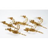 A set of five 20th century gilt metal twin branch wall lights, in the Louis XVI style,