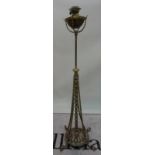 An early 20th century brass standard lamp with faux bamboo supports, 147cm high,