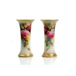 A pair of Royal Worcester beaker vases, circa 1912, each painted with pink roses, one by K.