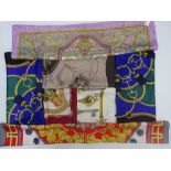 A collection of seven printed silk scarves,