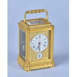 A French engraved gilt brass Gorge cased Petite Sonnerie carriage clock Late 19th Century With