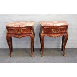 A pair of Louis XV style gilt metal mounted kingwood marble top bedside tables,