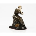 An early 20th century bronze figure of a seated female,