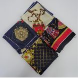 A collection of four Italian printed silk scarves,