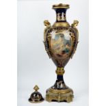 A large pair of Sevres style cobalt blue ground gilt-metal mounted earthenware vases and covers,