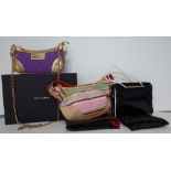A collection of three designer handbags,