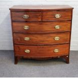 A George III mahogany bowfront chest of two short and three long graduated drawers,