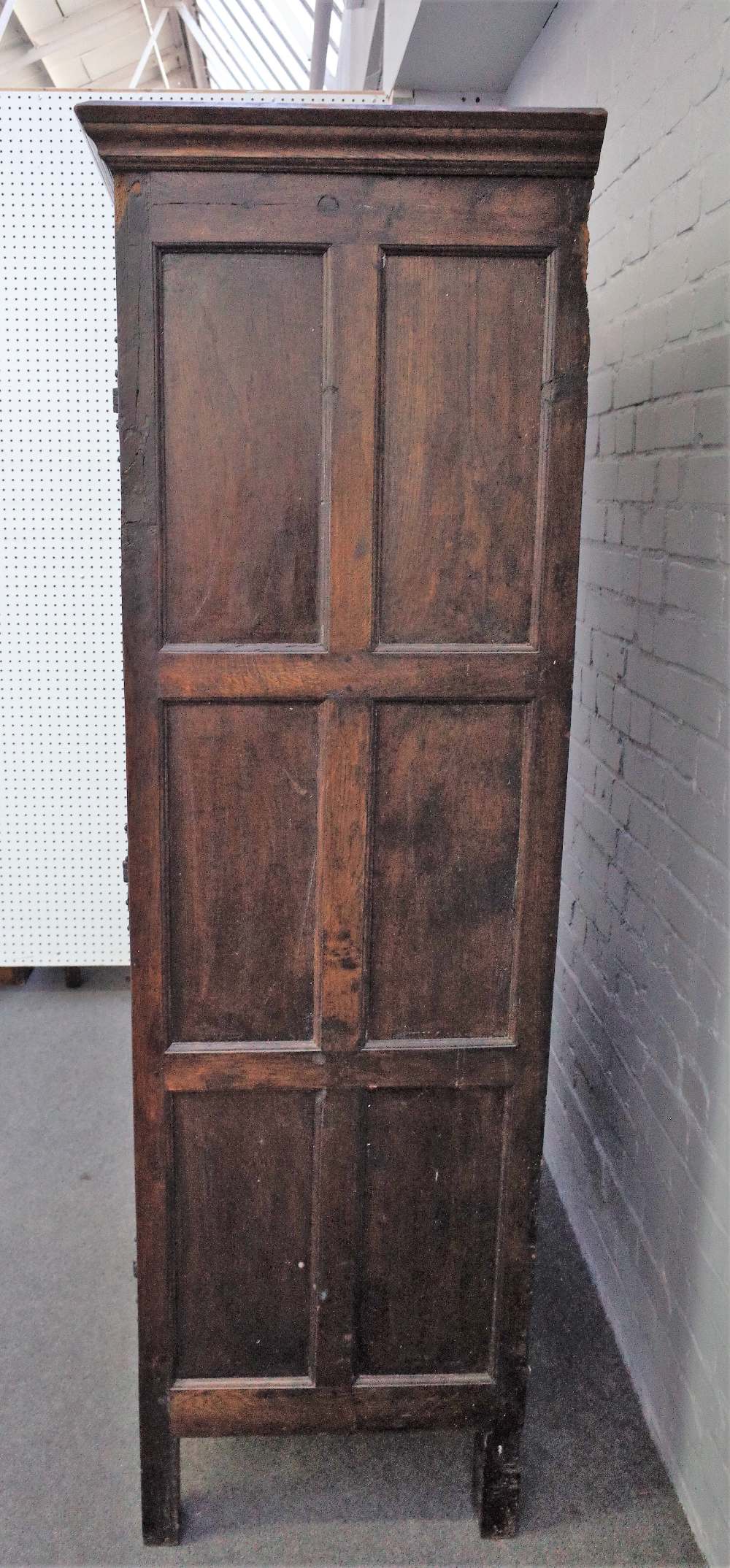 A 17th century style oak hanging cupboard, of panelled construction, incorporating earlier elements, - Image 5 of 6