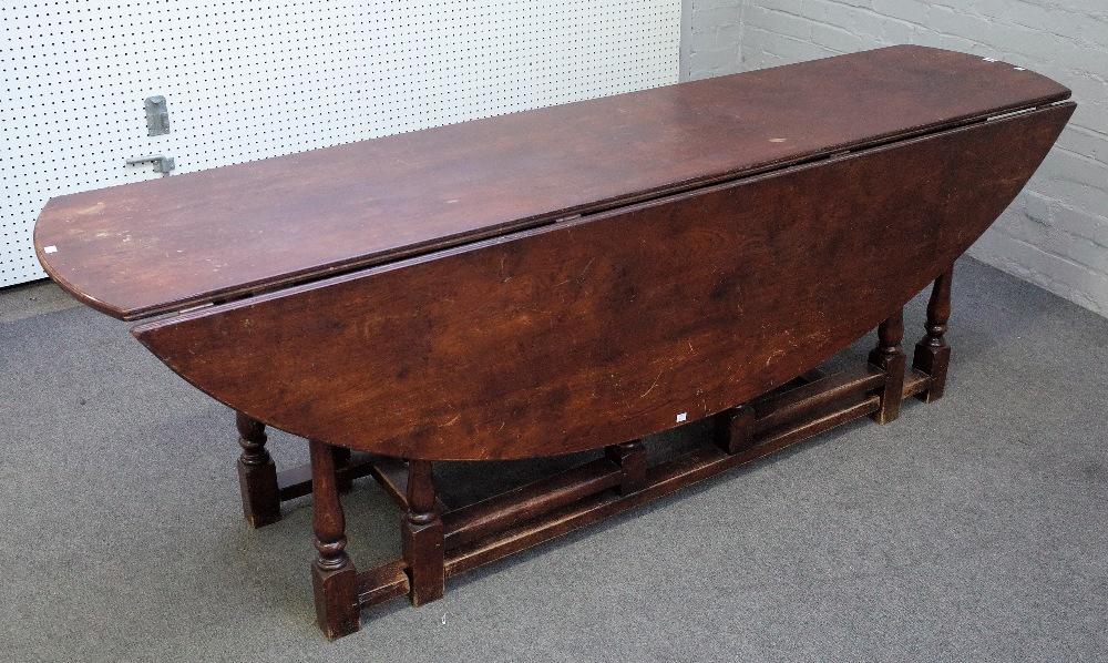 A large reproduction Charles II style oak gateleg table,