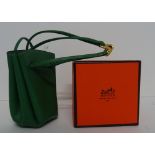 A Hermes green grained leather Vespa pouch,