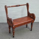 A Victorian Arts and Crafts stained oak box seat hall bench with turned back rail and supports,