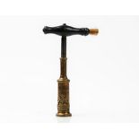 An Edwin Cotterill corkscrew, mid-19th century, with turned ebony handle and brush,