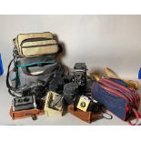 Collectables; a quantity of mid-20th century cameras and lenses, including Rolleiflex, Kodak,