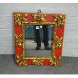 An early 20th century Spanish parcel gilt red painted square wall mirror,
