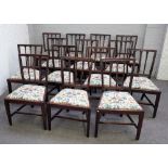 A set of sixteen George III mahogany stick back dining chairs on tapering square supports,