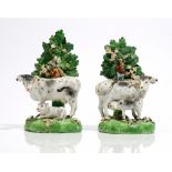 A pair of Derby porcelain cow and calf groups, early 19th,