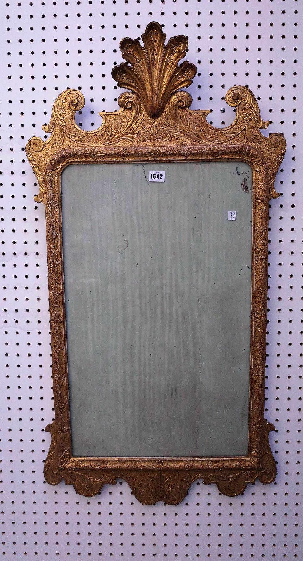 A George II style gilt framed mirror with shell crest and floral chased frame, 19th century,