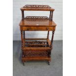 A Victorian burr walnut three tier Canterbury whatnot, fret carved and pierced,