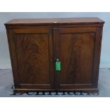 A late Victorian walnut side cupboard with panelled doors, 119cm wide x 104cm high.