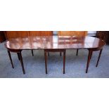 A George III mahogany triple section D-end extending dining table on tapering square supports,