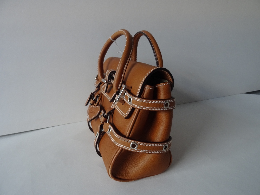 A Luella 'Giselle' tan leather handbag, with twin leather loop handles and strap decoration, - Image 5 of 10