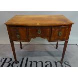 A 19th century mahogany bowfront sideboard with three frieze drawers on tapering square supports,