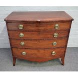 A George III crossbanded mahogany bowfront chest with four long graduated drawers on splayed