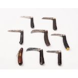A group of eight pocket knives, mostly bone handled, including examples by Saynor of Sheffield,