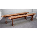 A pair of 19th century French oak benches, on baluster supports, 200cm wide x 54cm high, (2).