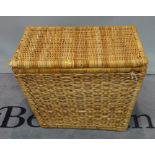 A 20th century wicker hamper of tapering rectangular form, 80cm wide x 57cm high.